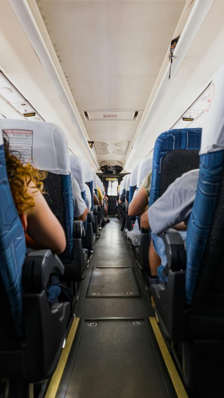 Coach Tour Driver needed in Staffordshire Passengers seated on a bus during a daytime journey, capturing a travel atmosphere.