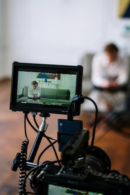 Occupational Therapist (Functional Assessor) needed in Middlesbrough (Remote) Camera focusing on a counseling session in an office setting, capturing a seated individual.